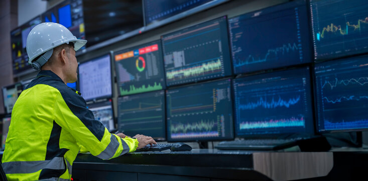 Engineer working at control room, Manager control system, Technician man monitoring program from a lot of monitor.
Specialist observes analytics dashboard,operator inspects digital interface