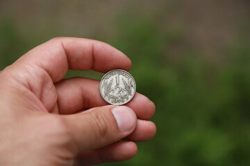 Indian coin quarter rupee in hand