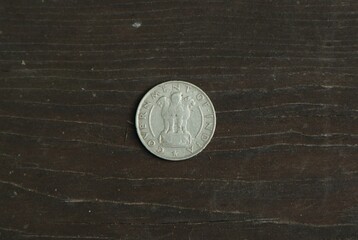 Coin half rupee on wooden table