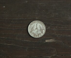 Coin half rupee on wooden table