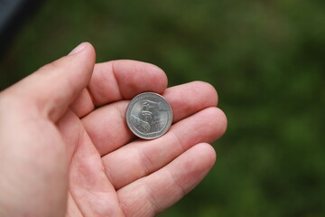 Commemorative quarter coin in hand