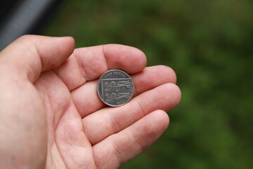 Coin of Great Britain in hand