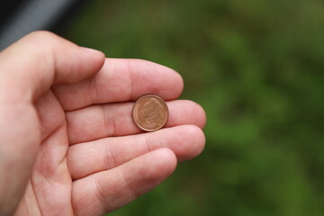 Greek change coin in hand