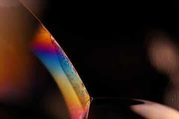 One colourful liquid line on black background 