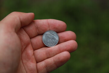 Indonesian change coin in hand