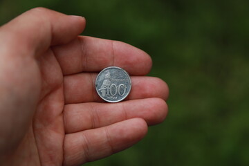 Indonesian change coin in hand
