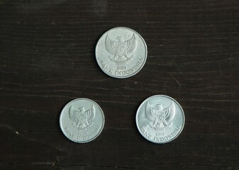 Indonesian change coin on wooden table