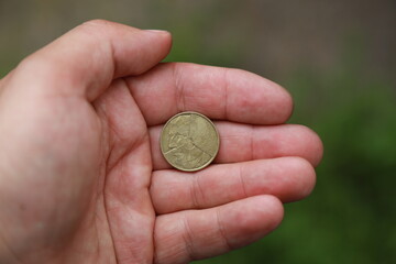 Belgian change coin in hand