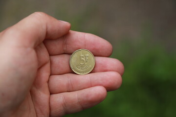 Belgian change coin in hand
