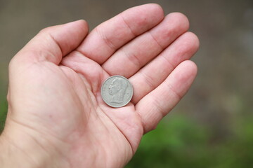 Belgian change coin in hand