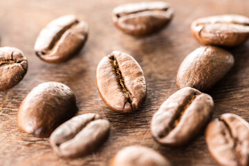 Coffee beans on grunge wooden background