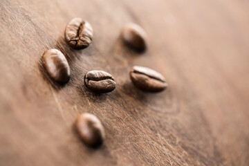 Coffee beans on grunge wooden background