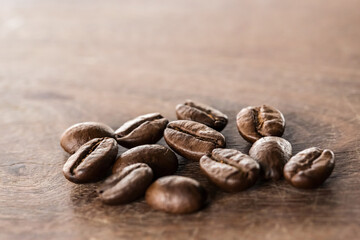 Coffee beans on grunge wooden background
