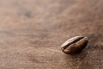 Coffee beans on grunge wooden background