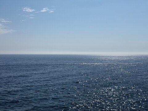 Shiny blue sea and clear sunny sky.