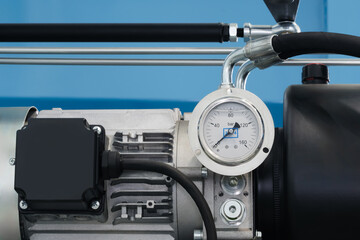 Industrial  concept. equipment of the boiler-house, - valves, tubes, pressure gauges, thermometer. Close up of manometer, pipe, flow meter, water pumps and valves of heating system in a boiler room.