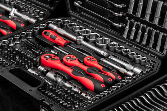 A toolbox with many different tools including pliers, wrenches, and screwdrivers. tools are organized in a way that makes it easy to find what you