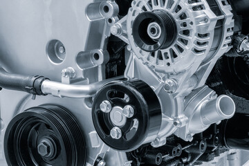 Close up of a car engine in blue tone, auto service concept background.