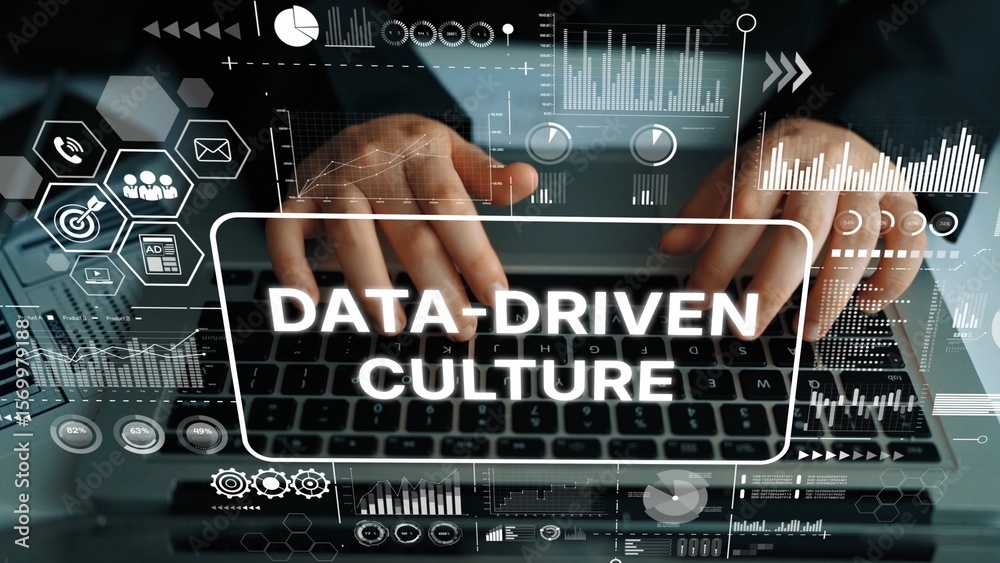 Poster hands typing on laptop surrounded by graphs and icons illustrating data-driven culture in modern bus