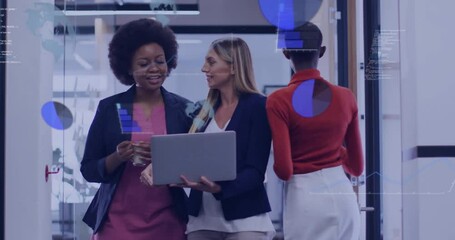 Businesswomen entering glass corridor starting AR charts overlay during joint data review session - Powered by Adobe