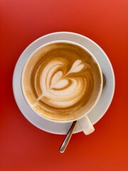 Cappuccino on a red table