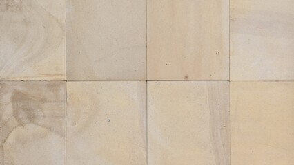 Light brown wooden boards are divided into squares, many wooden boards are connected together, the surface of the wooden boards.