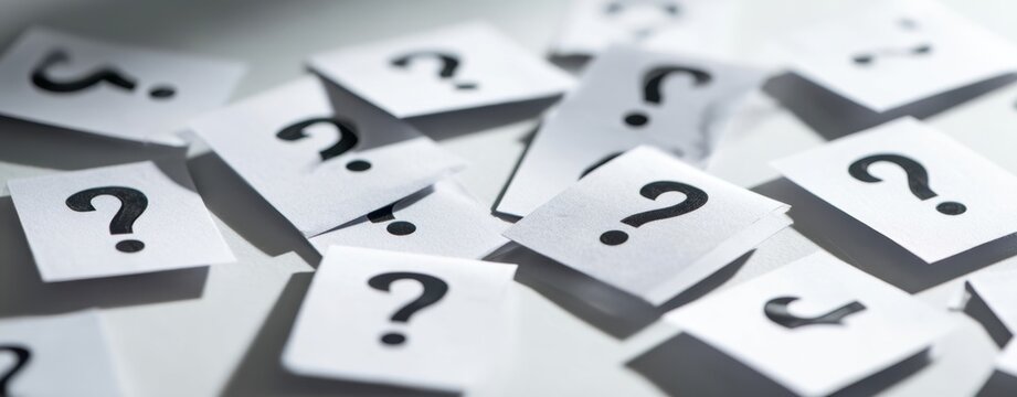 The scattered question marks symbolize an array of inquiries and ideas.