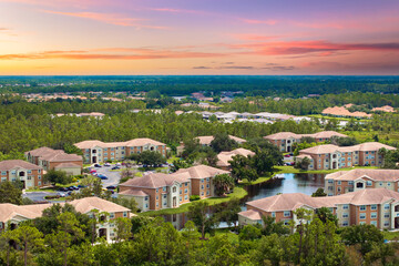 American condominium buildings in Florida suburb, reflecting real estate investment and residential...