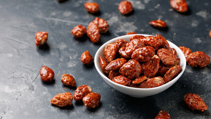Caramelized almonds. Toasted almonds coated with caramel syrup.