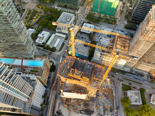 Miami, Florida. USA big city urban landscape at sunset. Developing American megapolis with new high-rise buildings under construction
