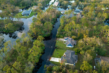 Surrounded by hurricane rainfall flood waters homes in Florida residential area. Aftermath of...