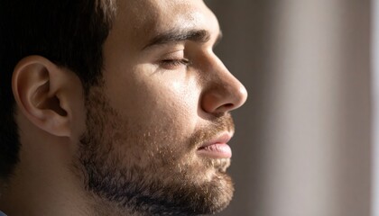 Man with a beard and a tie looking away