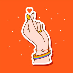 Hand showing heart sign with LGBTQ flag color bracelet on red background  - vector illustration for happy pride month sticker