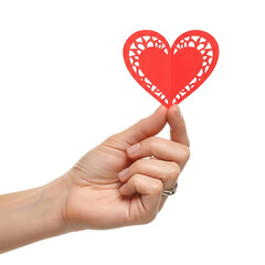 Hand holding a red heart shaped paper cutout with a decorative edge against a plain backdrop on transparent background