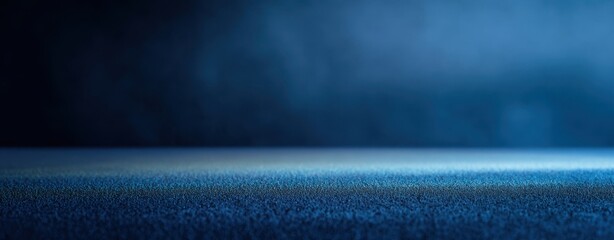 The textured blue background with soft mist and elegant gradients.