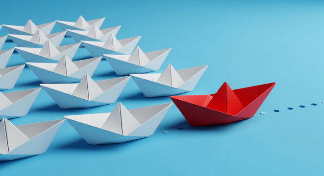 Many white paper boats follow a red paper boat leading the way on a blue background, symbolizing leadership, innovation, and breaking from the norm - Powered by Adobe