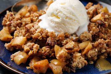 Freshly baked apple crumble pie with ice cream