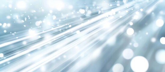 Abstract shimmering light streaks background in cool blue tones conveys a sense of ethereal movement and sparkling energy