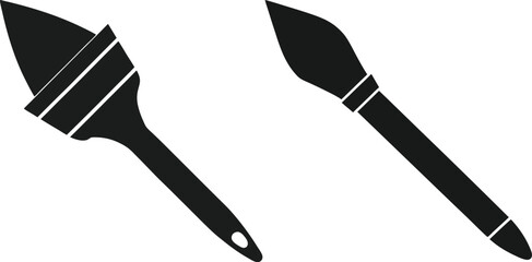 Artistic Touch: Two elegant paintbrushes lay side-by-side, their sleek forms embodying creativity, design and a love for artistry.