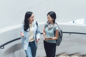 Two Young Women Talking on Stairway