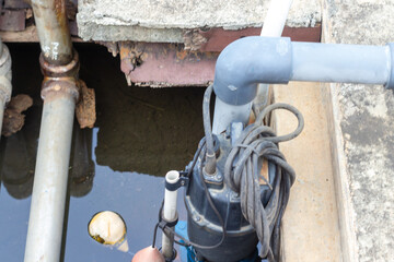 Submersible Water Pump in Concrete Well for Drainage