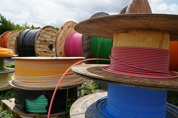 Big Rolls with colorful cable drums, fiber optic cables for faster Internet in rural region of...