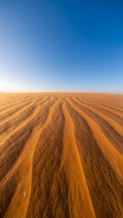 Obraz premium Exploring the vast desert landscape sand dunes under clear blue sky scenic beauty