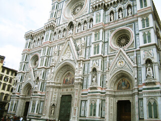 View of the historic center of Florence, Italy, featuring the iconic Cathedral. The surrounding Renaissance architecture, narrow streets, and rooftops create a timeless cityscape that highlights