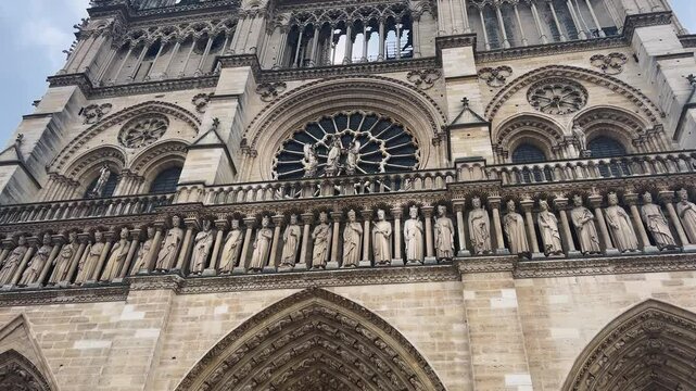 View of the main western facade of the of medieval Catholic cathedral Notre Dame de Paris, Cathedral of Our Lady of Paris, Ile de la Cite, 4th arrondissement of Paris, France.