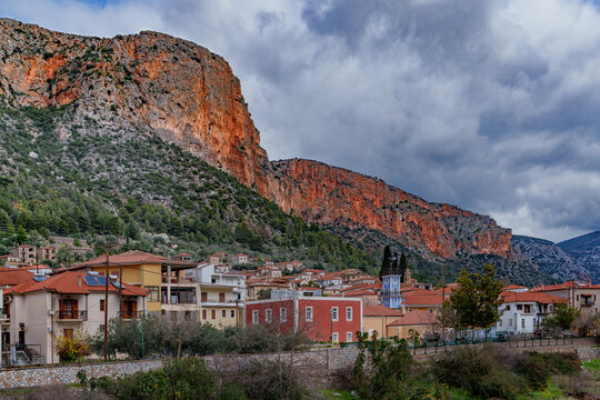 Beautiful view of a small town nestled beneath rocky mountains