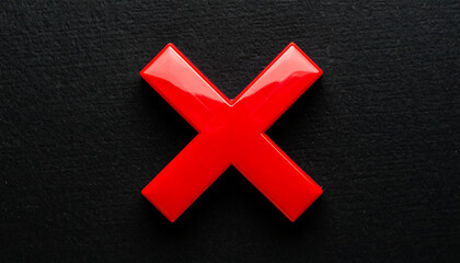 Shiny red cross mark isolated on black backdrop. Disapproval, error, mistake or cancellation concept