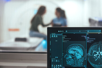 Brain Imaging in Medical Setting with MRI Scan Display on Screen