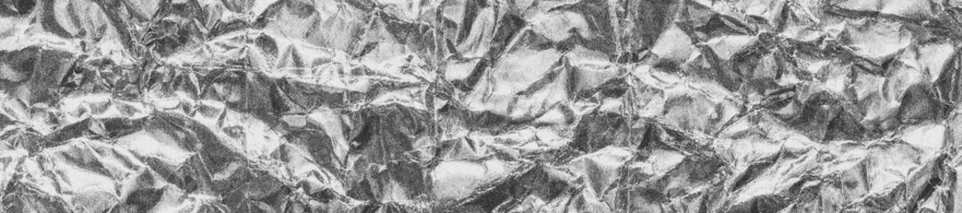 Silver gray grainy wrinkled foil, black and white long web banner with noise retro film effect