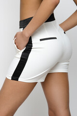 Close up of a white short with black accents